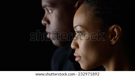 Dramatic profile rack focus of two young black people