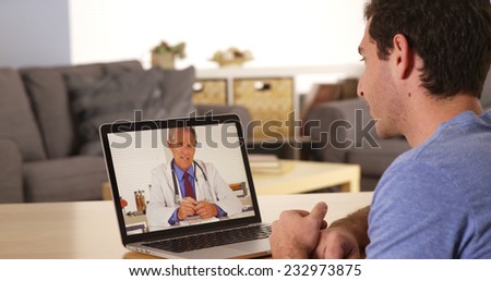 Guy using laptop to talk to doctor