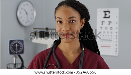 Successful Black woman doctor smiling at camera
