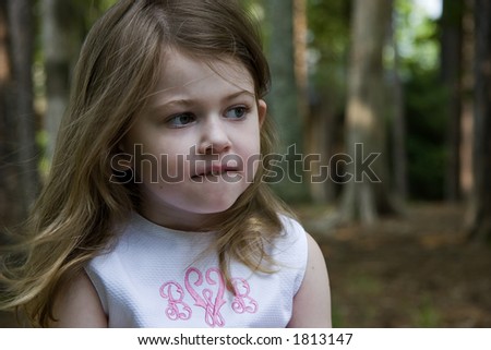 A Little Girl Biting Her Lip, Trying to Make a Decision