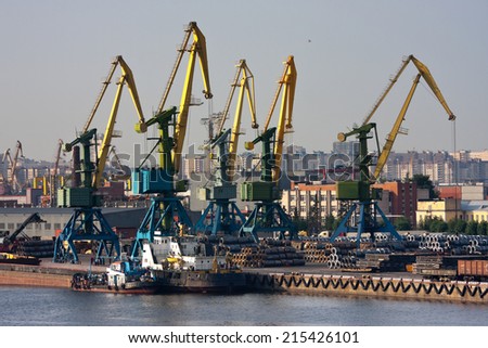 View of sea trade port with ships and cranes