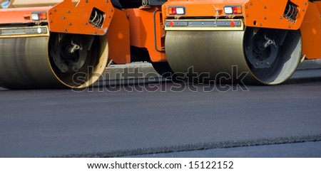 Road roller repairing asphalt pavement
