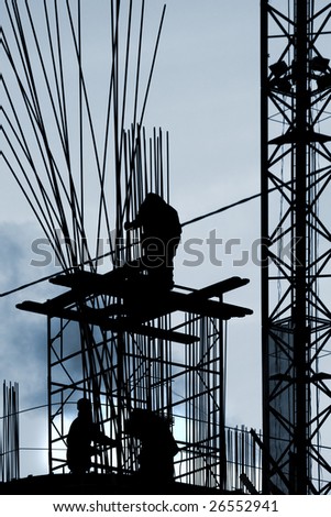 Construction works: silhouettes of 3 workers