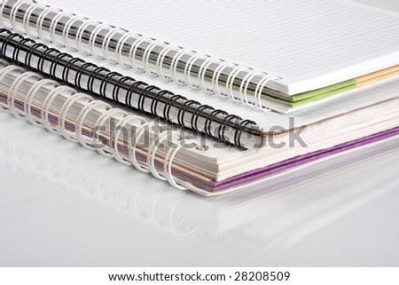 Three school notebooks with spiral binding