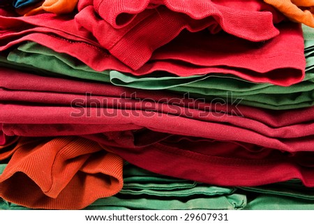 Stack of color clothes stored in rows