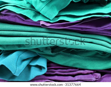 Stack of color clothes stored in rows