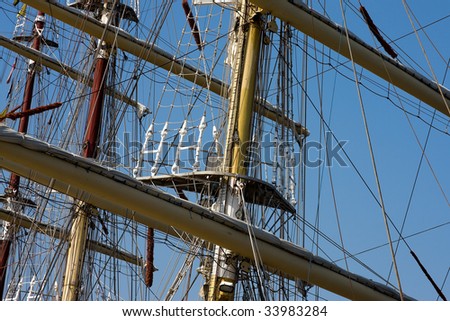 Sail ship masts with blue sky background