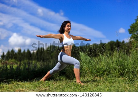 girl doing yoga outdoor with open eyes, ladscape