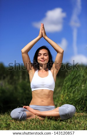 girl doing yoga outdoor and smiling with closed eyes, vertical