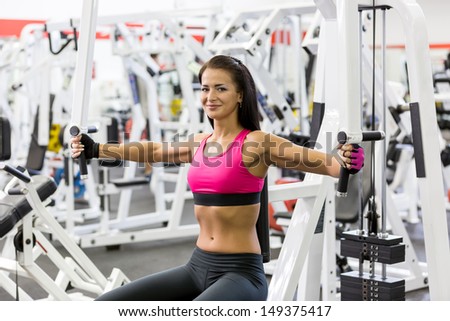 Young women do a workout at the gym and smiling