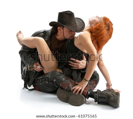 stock photo : brutal man making tattoo on a girl's hip isolated over white