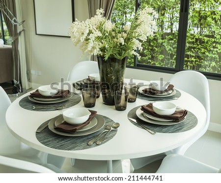 dining table and artificial flower in modern dining room