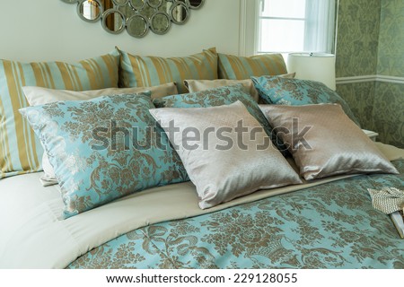 bed and green pillows in bedroom