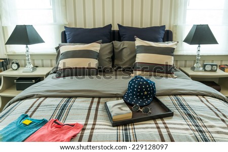 modern bedroom with pillows and caps