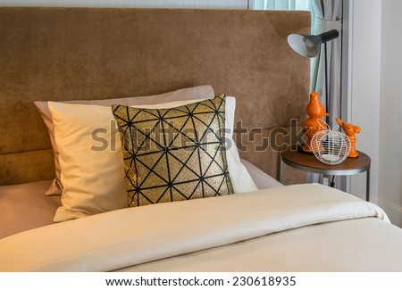 single bed with bedside tables and reading lamp