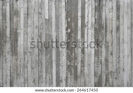 texture of wooden form work stamped on a raw concrete wall as background
