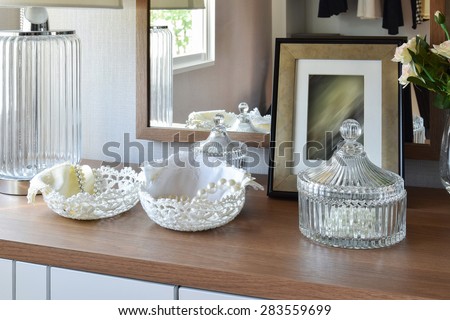 wooden table with jewelry set ,mirror,lamp in dressing room