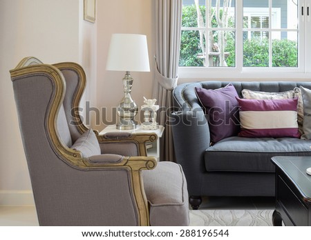 luxury living room design with classic sofa, armchair and decorative table lamp