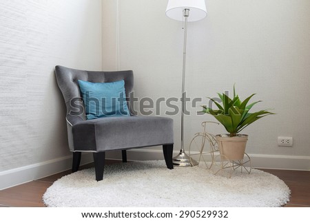 luxury grey tweed sofa with blue pillow in living room