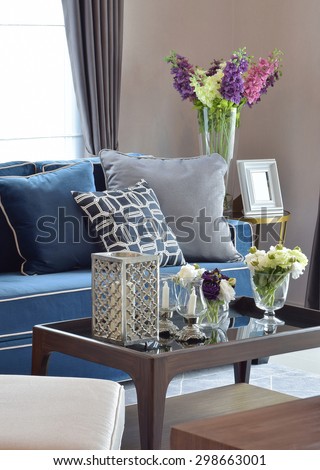 Romantic candle set with beige and blue modern classic sofa in warm living room