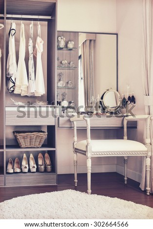 vintage style photo of dressing room with classic white chair and dressing table