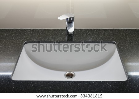 Modern style faucet with black granite counter top