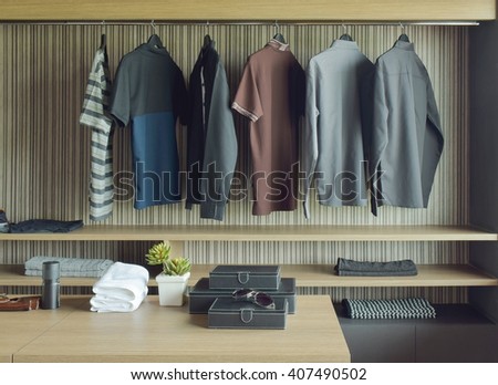 Men cloths in wooden walk in closet
