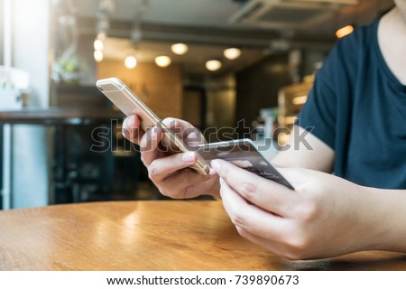 woman hand using smartphone for mobile transaction or shopping online. (fintech, financial and technology concept)