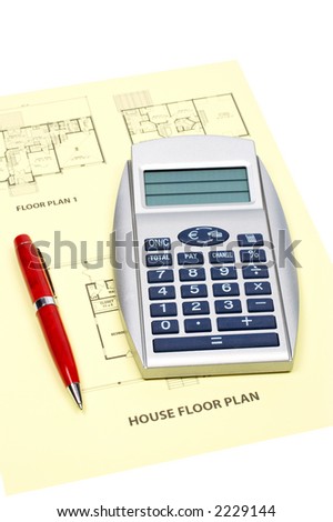 House floor plan, pen and calculator on white background (small DOF)