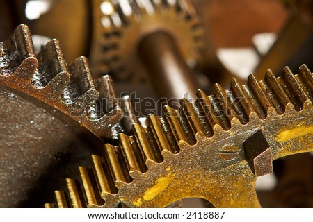 An old and dirty industrial gears background. Shallow DOF