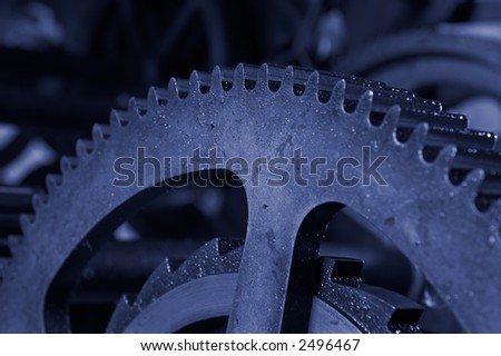 An old and dirty industrial gears background. Shallow DOF