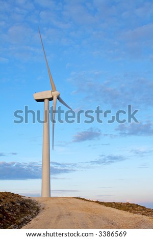 Wind turbines farm on sunset in winter
