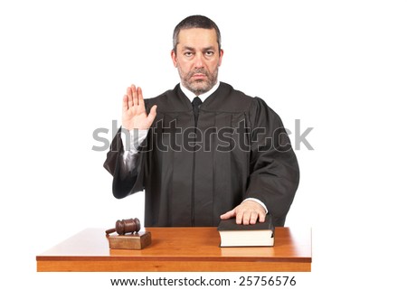 A serious male judge taking oath in a courtroom, isolated on white background. Shallow depth of field