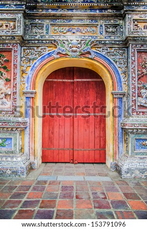 Old wooden red door in Vietnam