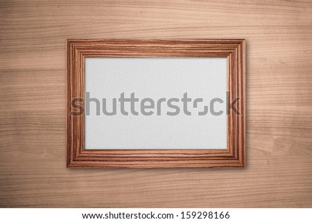 Wood frame with canvas on wood background