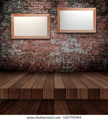 Empty photo frames on the brick wall