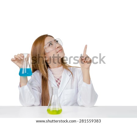 Asian scientific researcher holding at a liquid solution and point her finger to something in the air