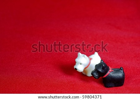 Small dog model on red velvet