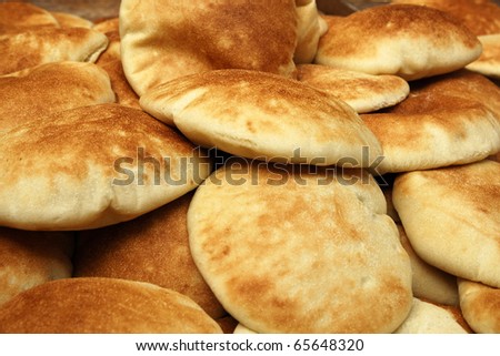 Stack of pita bread in a market bakery