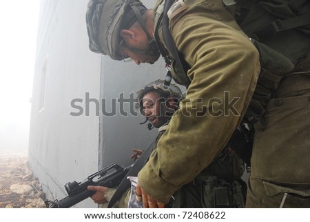 ELYAKIM, ISRAEL - MARCH 01: Israeli infantry train in urban combat fighting. March 01, 2011 in Elyakim, Israel
