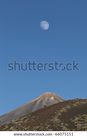 Moon over Mount Teide or, in Spanish, Pico del Teide, the third largest volcano on earth from its base, Tenerife, Canary Islands, Spain