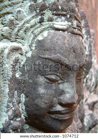 stone sculpture of face in Cambodian Temple