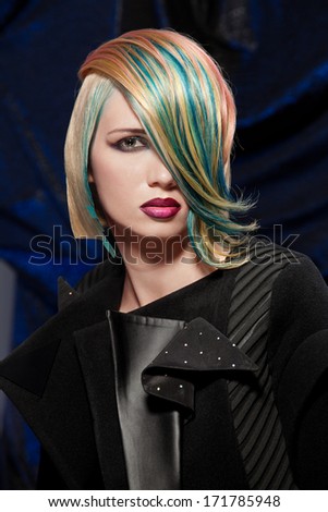 beautiful blonde young woman with fancy coloured hair; portrait of a fashion model with dyed hair