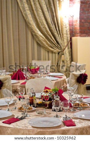 Fancy table set for a wedding dinner, in ancient, brick wall location