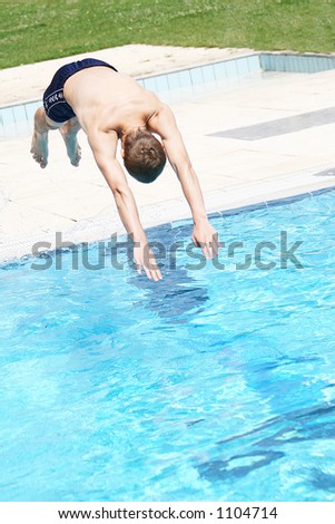 Diver is jumping into the pool