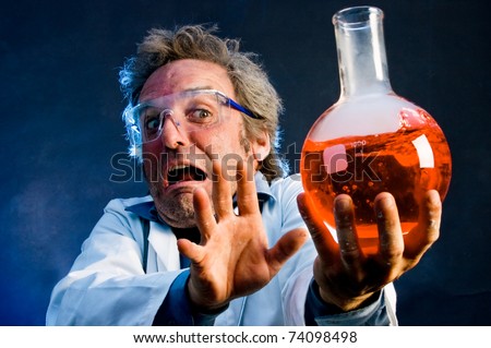 Mad Scientist extending explosive concoction away from his face