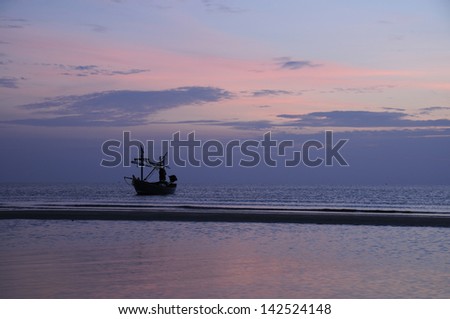 Morning Scene of Fishing boat, Calm Sea and Pastel Sky in Prachuabkirikan, Thailand