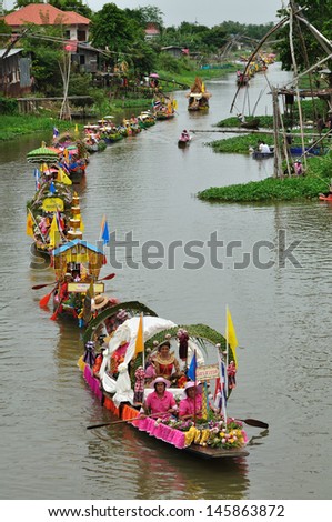 AYUTTHAYA, THAILAND - JULY 26: Top view of Beautiful flower boats in floating parade, the unique annual candle festival of Buddhist lent on July 26, 2010 in Ladchado, Ayutthaya, Thailand