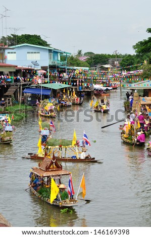 AYUTTHAYA, THAILAND - JULY 26: Top view of beautiful flower boats in floating parade, the unique annual candle festival of Buddhist lent on July 26, 2010 in Ladchado, Ayutthaya, Thailand