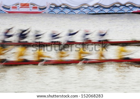 Two rowing teams in full speed blurred by motion